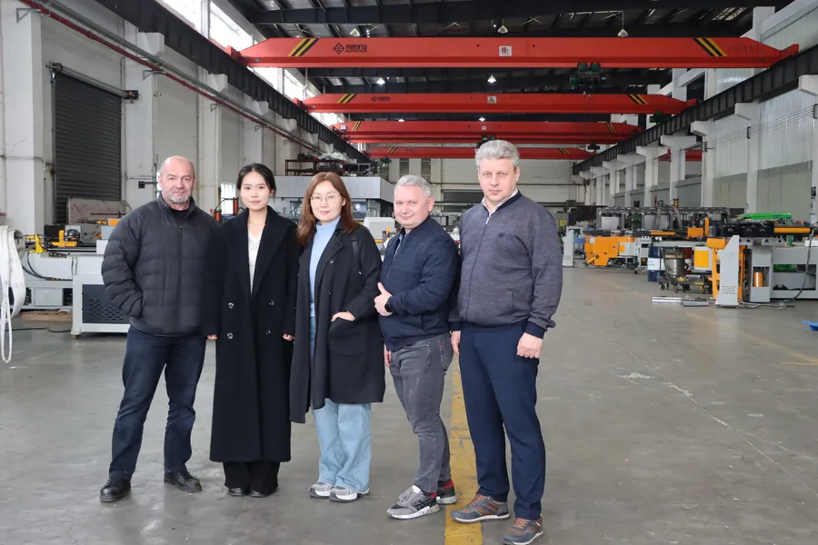 Group of overseas customers at the Telhoo pipe bending machine factory