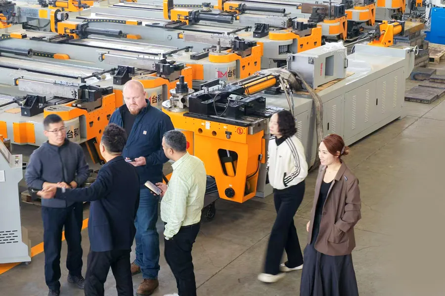 Overseas buyers reviewing Telhoo pipe bending machines at the factory