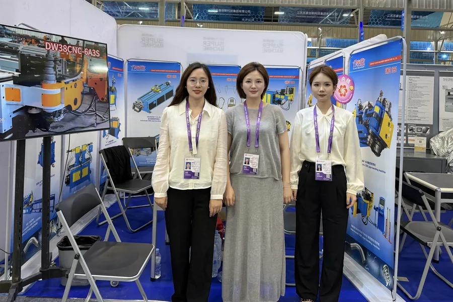 Telhoo sales team at a tube bending machine exhibition booth